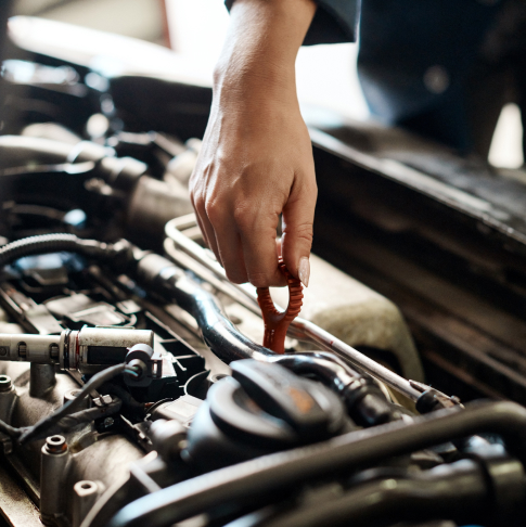 Car, hand and mechanic with person in workshop for maintenance, repair or service of engine. Auto, expert and inspection with vehicle engineer or technician checking dipstick for oil level in garage