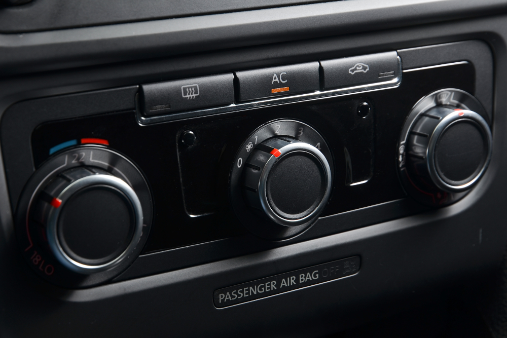 a/c repair, auto repair in Buffalo, NY at Total Automotive. Image of vehicle A/C control knobs and settings panel, representing vehicle cabin temperature control and HVAC system service.